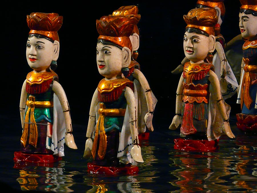 Go to a water puppet show in Hanoi